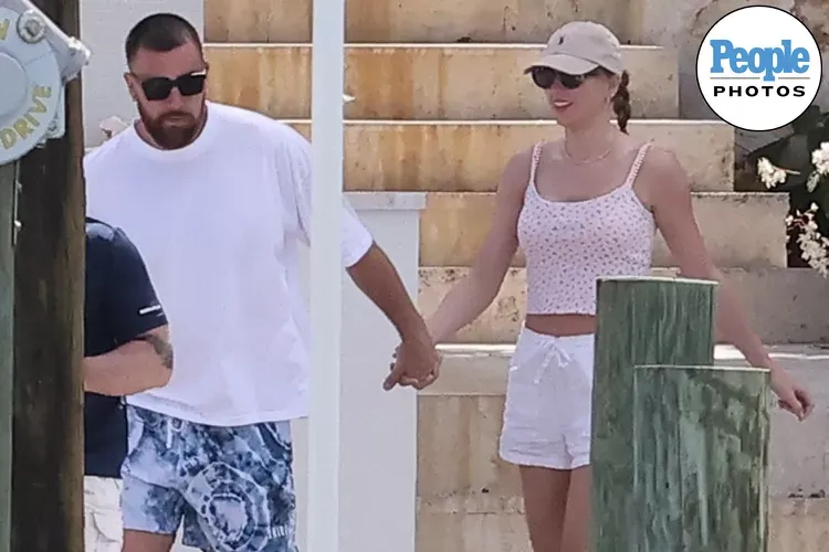 Taylor Swift Rocks Signature Red Lipstick with Shorts on Boat Date with Beau Travis Kelce