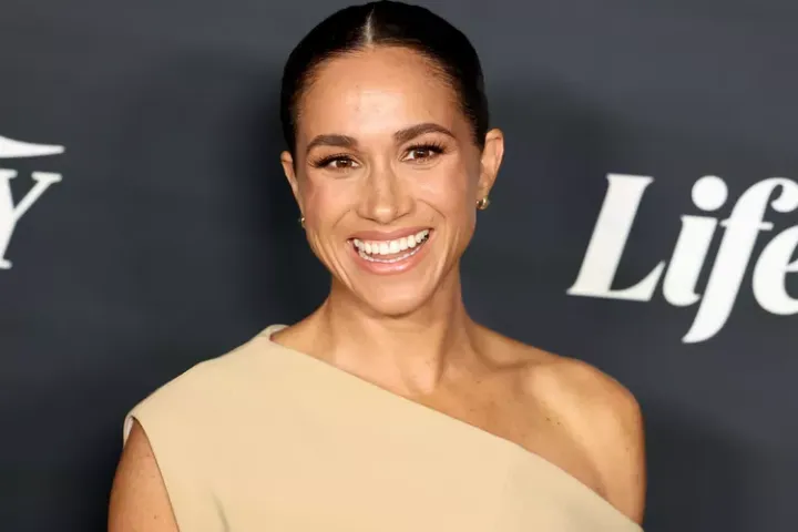 A picture of Meghan Markle laughing 